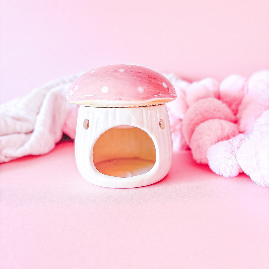 Pink mushroom ceramic oil burner

Whimsical mushroom fragrance oil diffuser

Cozy woodland scent warmer

Giftable pink mushroom oil burner