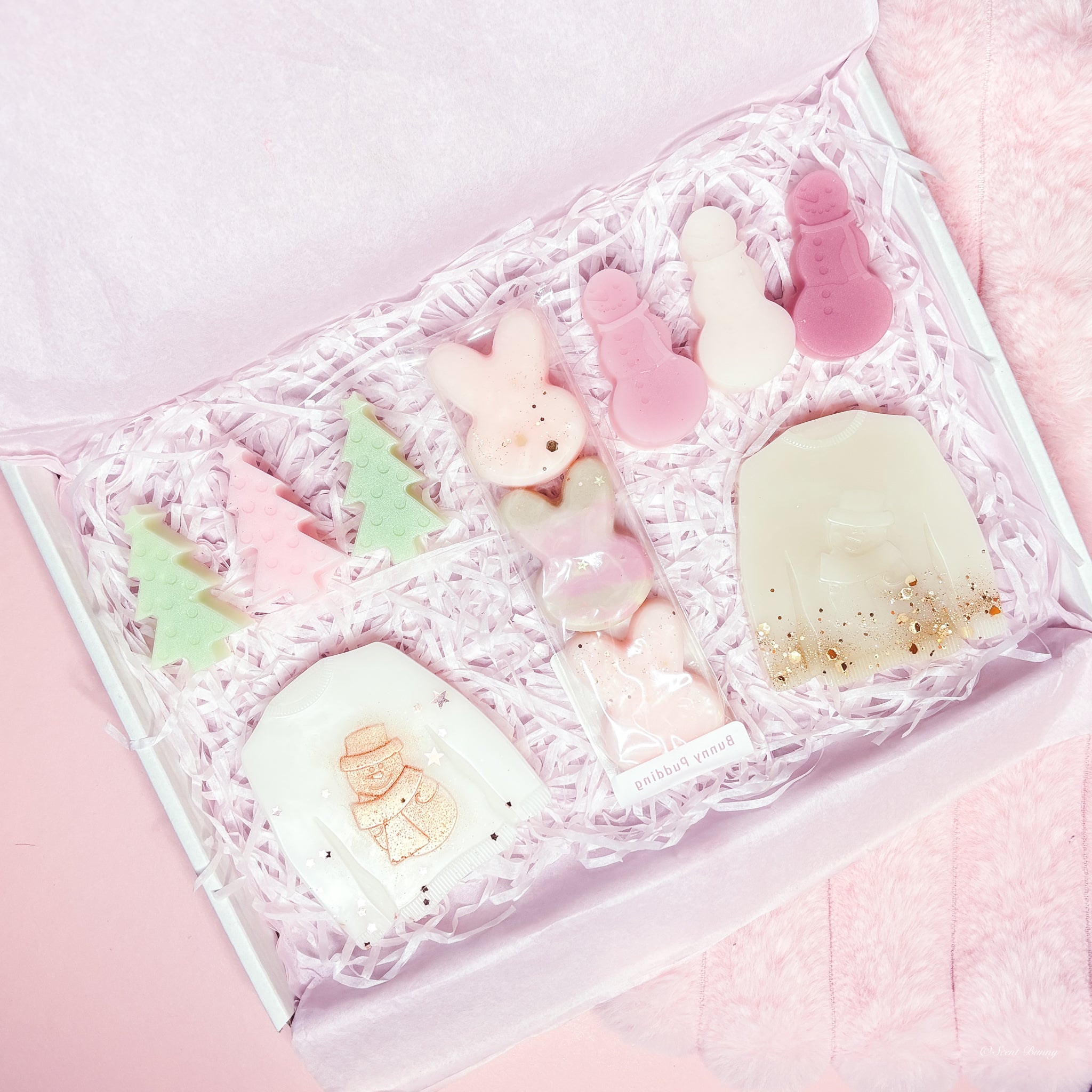 December Bunny Box festive wax melt collection with jumper, snowman, tree, and bunny shapes by Scent Bunny, handmade Belfast.​

Five-scent December Bunny Box wax melts Blanc, Toasty, Quartz, Cedar, Bunny Pudding by Scent Bunny, handmade wax melts Belfast.​